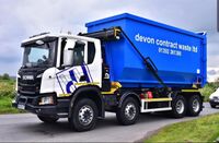 Hooklift Lorry with Ro Ro Skip in situ for road transport all rights reserved Devon Contract Waste